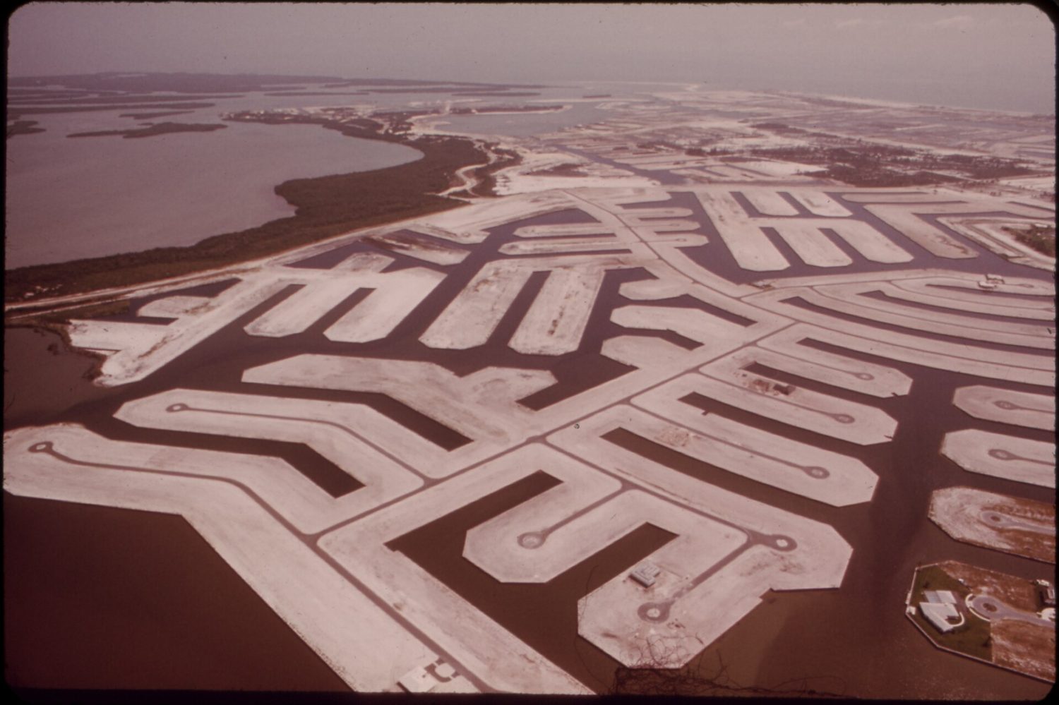 MARCO ISLAND LAND DEVELOPMENT ON THE SOUTHWEST FLORIDA COAST. MANY COASTAL DEVELOPERS DIG CHANNELS FOR WATERFRONT...